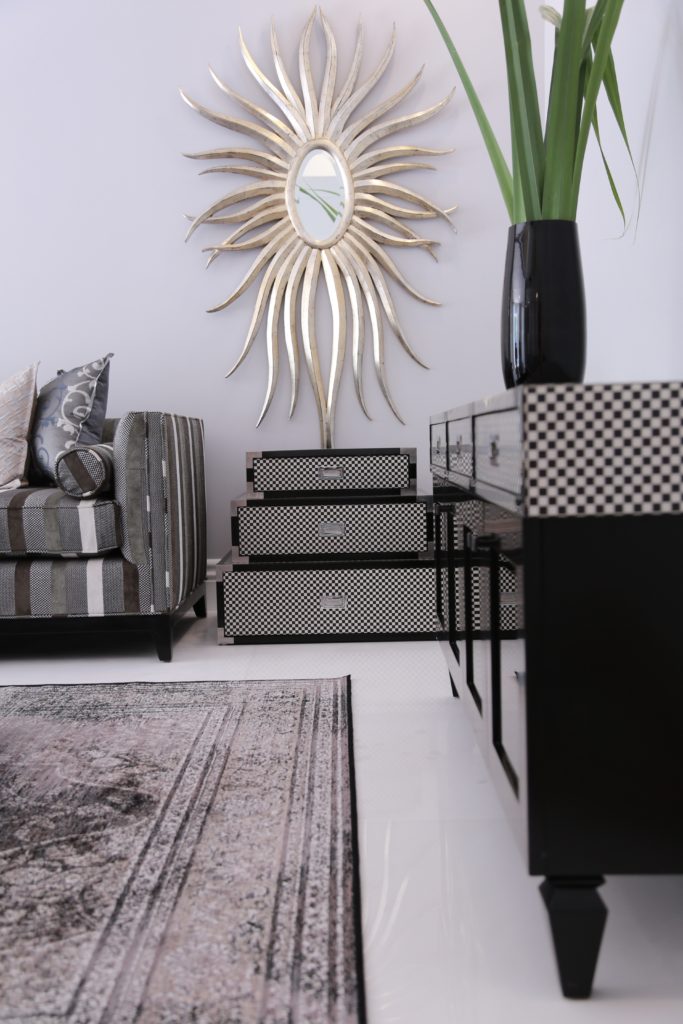mirror-rugs-blackandwhite-occasionalchairs-black-trunks-tvunit-checkerboard-sugarbakers